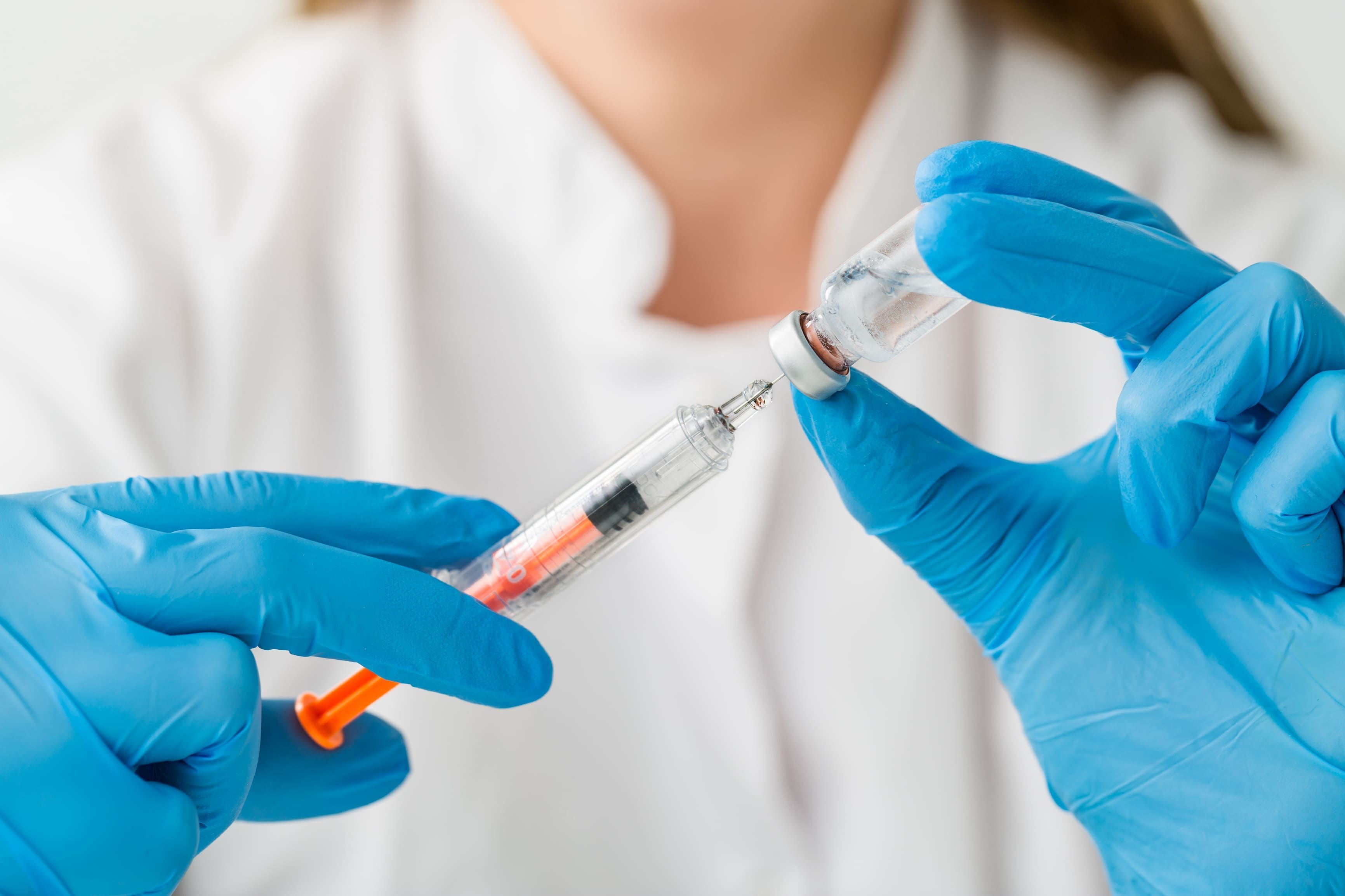 Healthcare professional preparing a vaccine